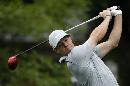 Rory McIlroy, of Northern Ireland, watches his tee shot on the 10th hole during the second round of the PGA Championship golf tournament at Valhalla Golf Club on Friday, Aug. 8, 2014, in Louisville, Ky. (AP Photo/David J. Phillip)