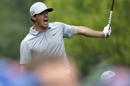 Rory McIlroy, of Northern Ireland, watches his tee shot on the 12th hole during the second round of the PGA Championship golf tournament at Valhalla Golf Club on Friday, Aug. 8, 2014, in Louisville, Ky. (AP Photo/David J. Phillip)