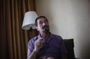 John McAfee, anti-virus software guru, speaks during an interview with Reuters in Guatemala City