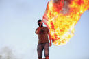 A protester burns a U.S. flag